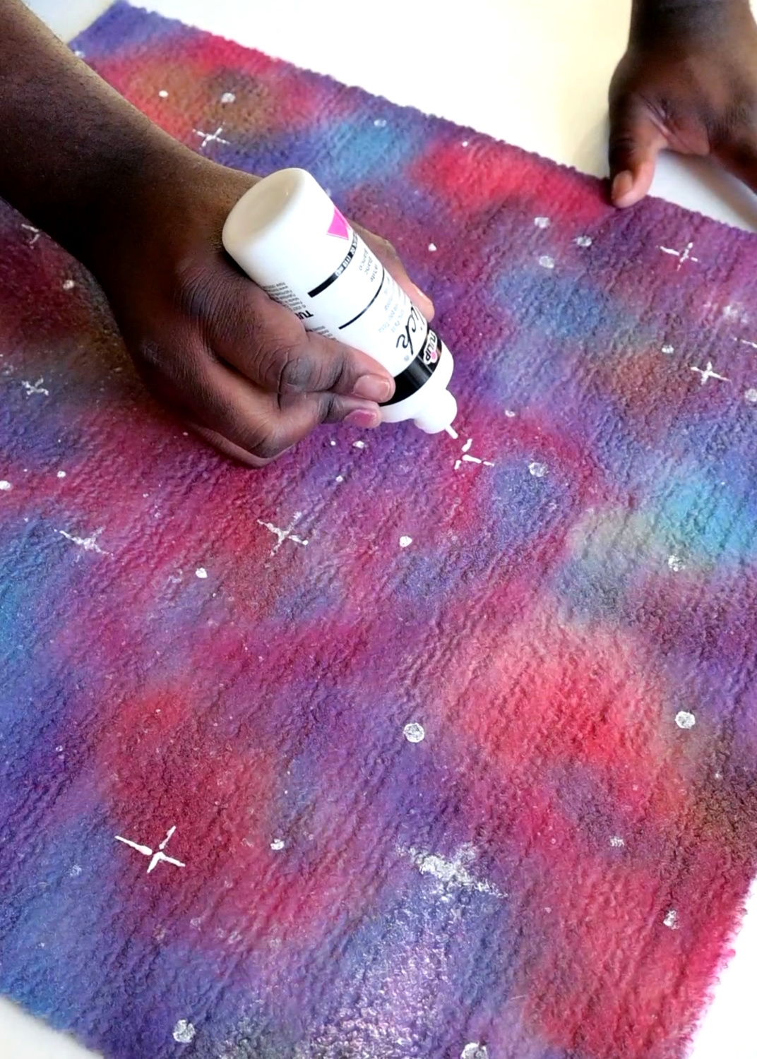 Use white paint to create stars