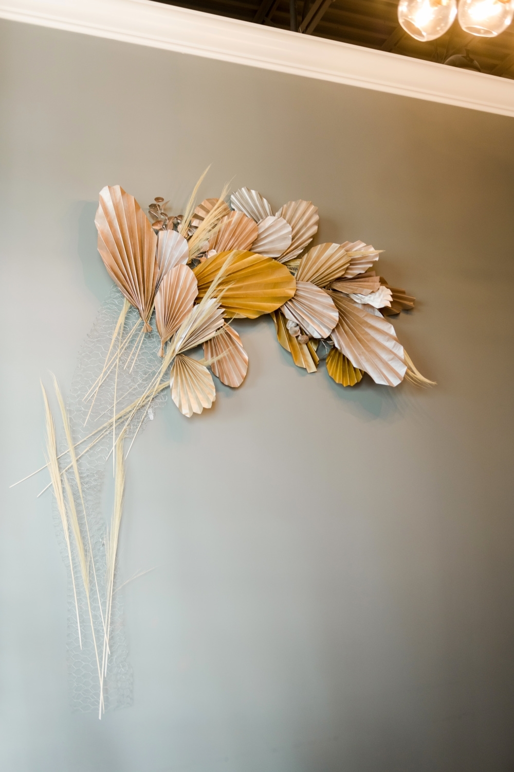 Assemble floral wall art onto wire structure