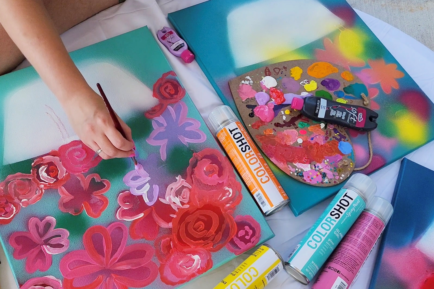Use a paintbrush to add more detail to your spray paint art 