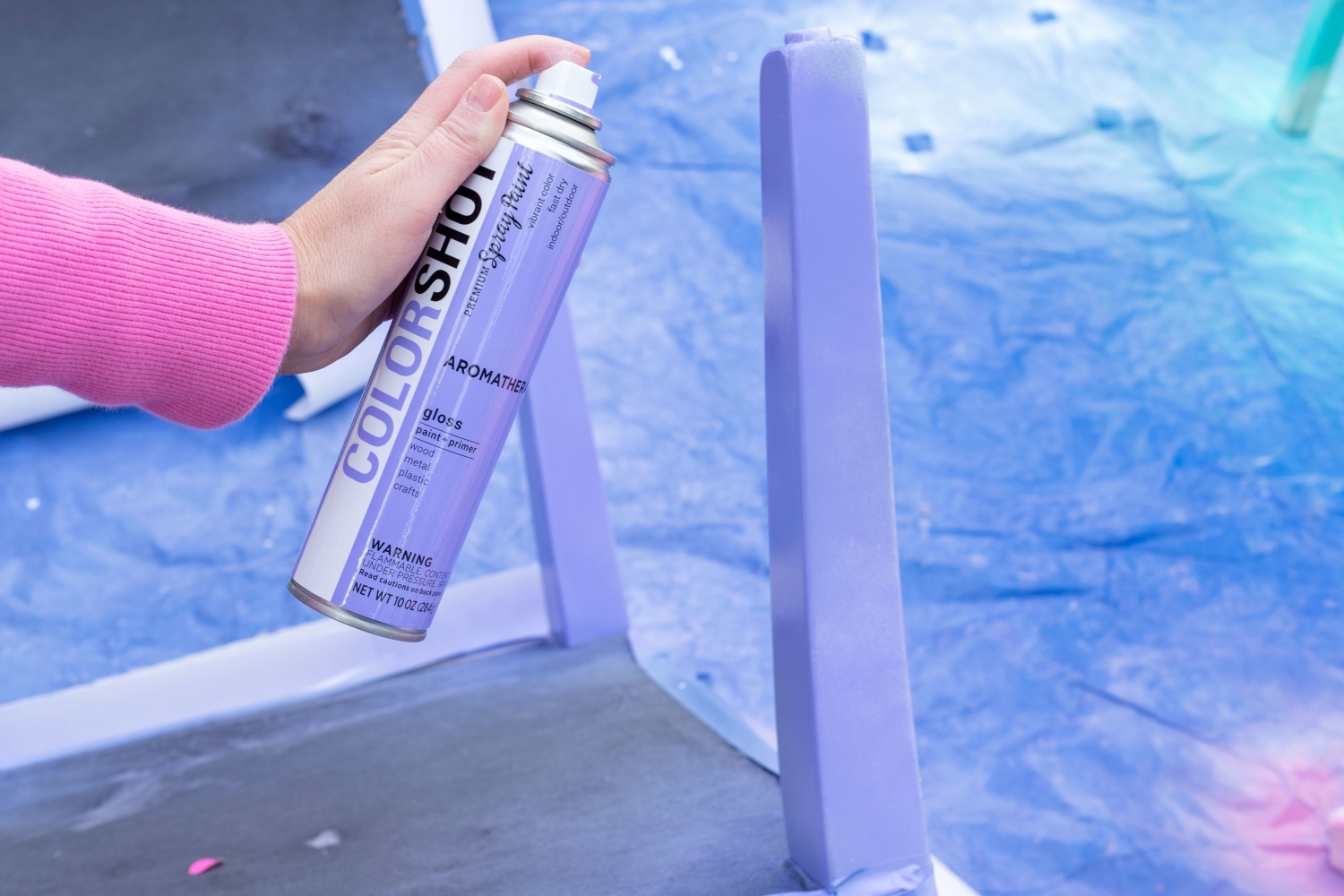 Apply a second coat of spray paint to she shed furniture